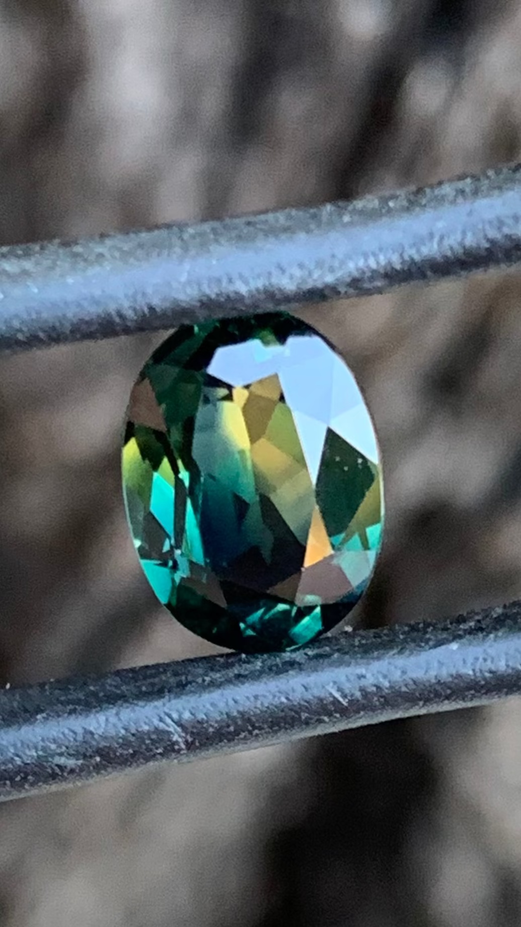 2.23ct teal parti Australian sapphire oval cut with distinct yellow zone from the Central Queensland Gemfields