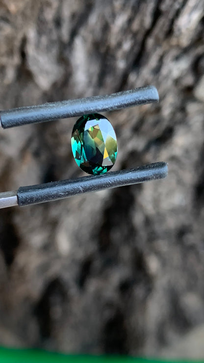 Oval teal parti Australian sapphire with striking yellow zone and beautiful colour play