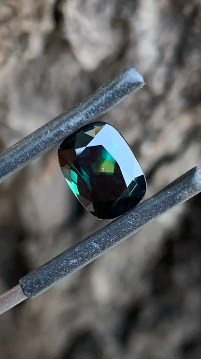 3.74ct dark parti Australian sapphire cushion cut with yellow Pharaoh’s Eye from Central Queensland