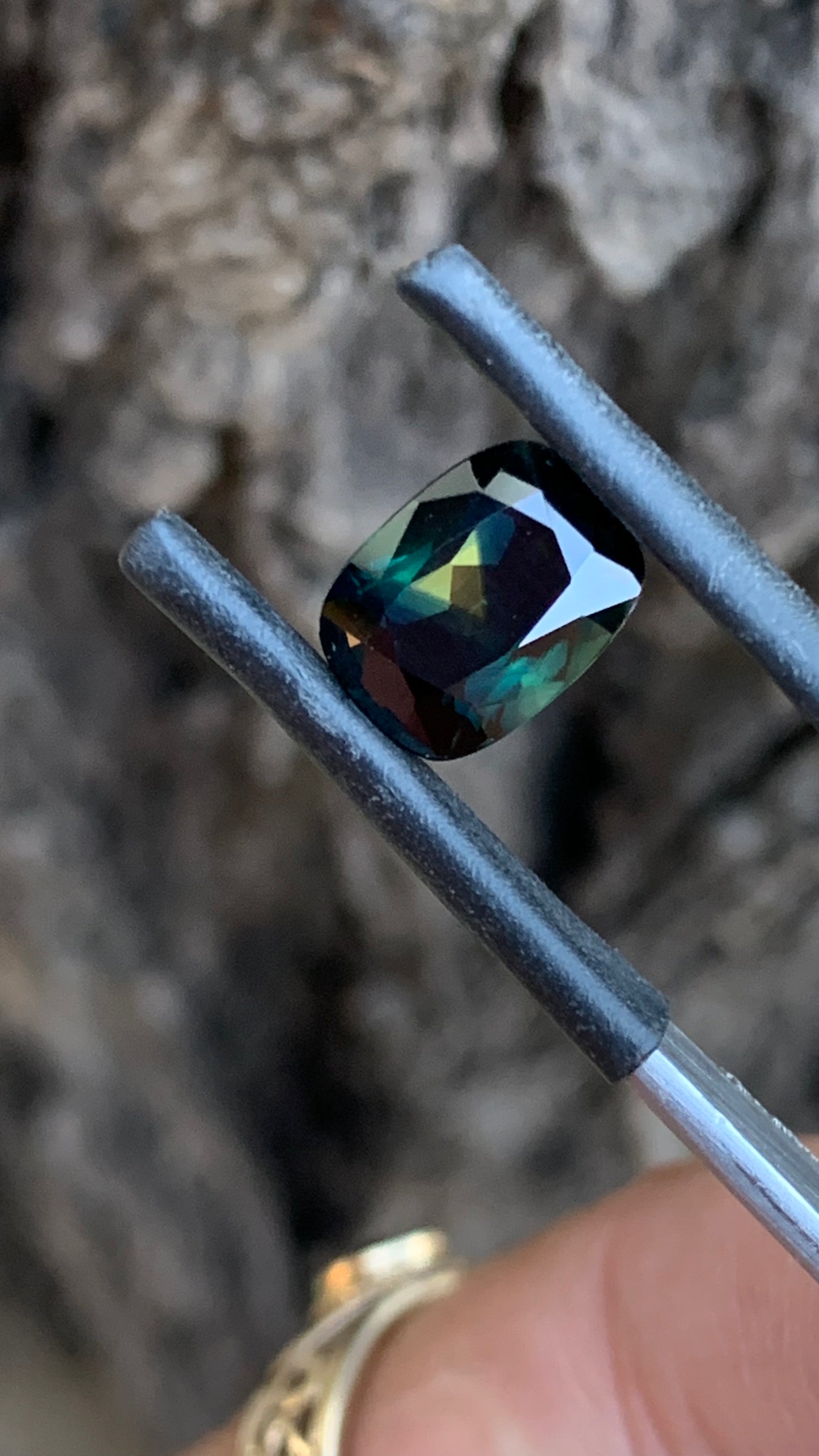 Eye clean heated Australian parti sapphire with deep moody colour and yellow triangle