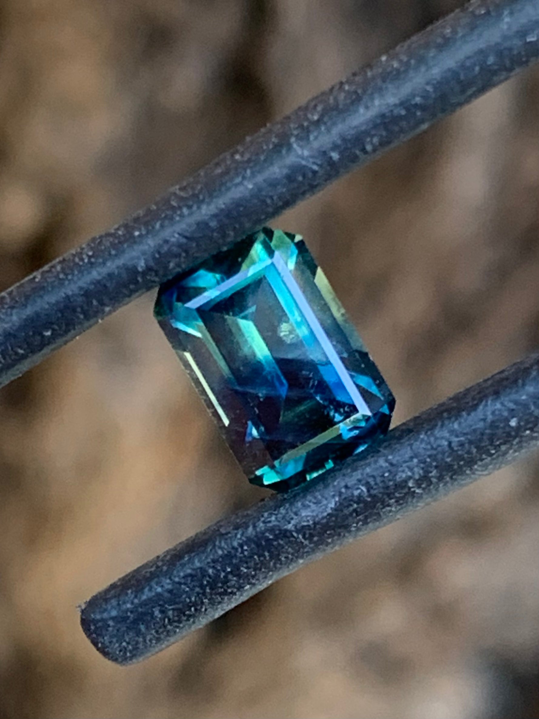 1.42ct teal parti Australian sapphire emerald cut with split colour zoning
