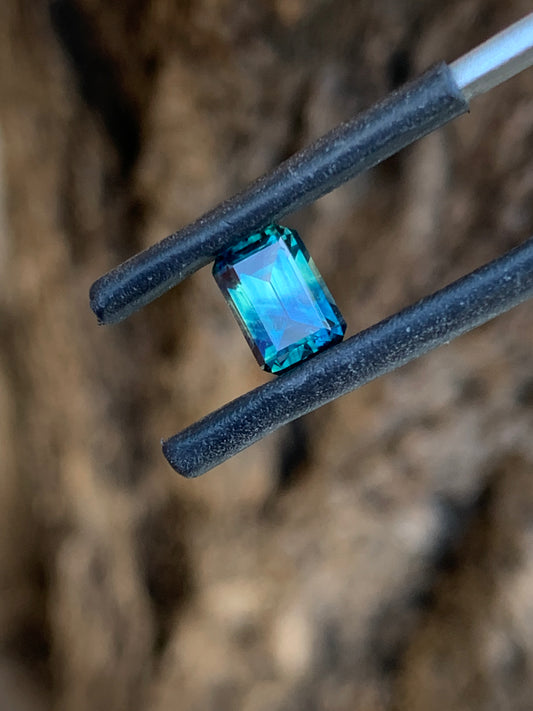 Emerald cut Australian sapphire with unique split teal colour zoning